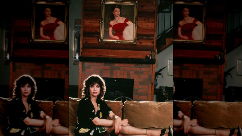 Lana Wood sitting under portrait of Natalie