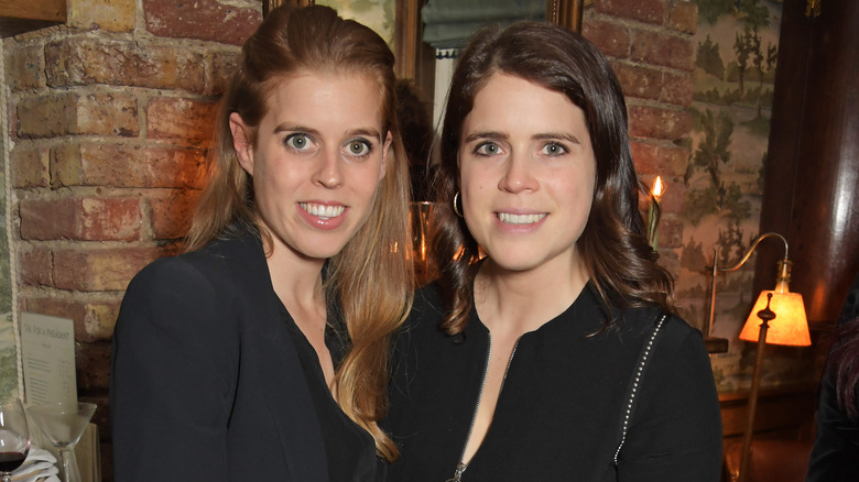 Princess Beatrice and Princess Eugenie posing   