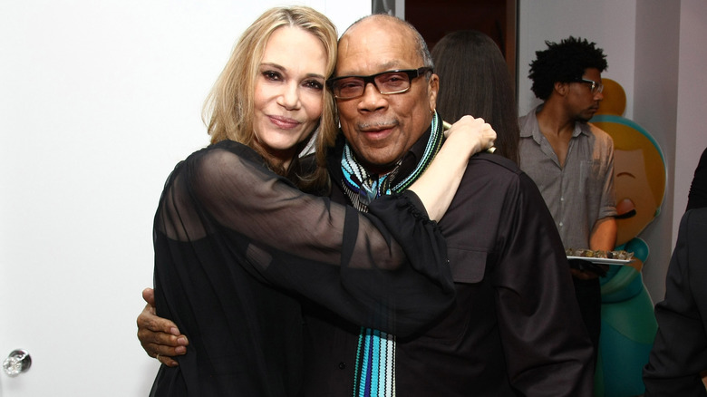 Quincy Jones and Peggy Lipton posing for photos