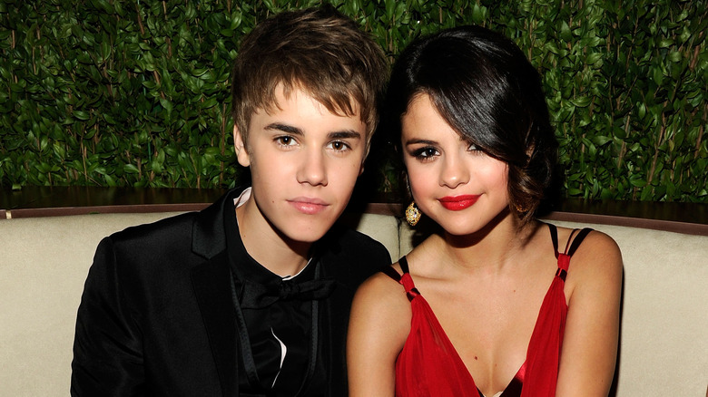 Justin Bieber and Selena Gomez smiling. 