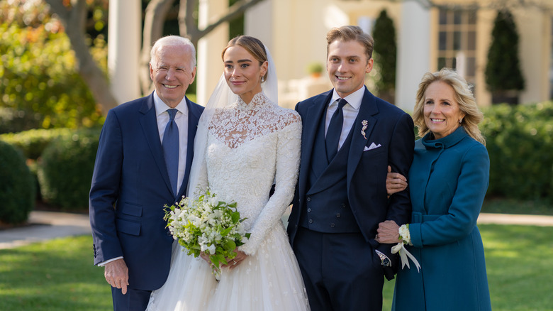 Joe and Jill Biden smile with their granddaughter, Naomi Biden, and her husband on their wedding day