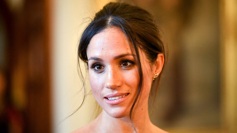 Meghan Markle poses for a photo. 
