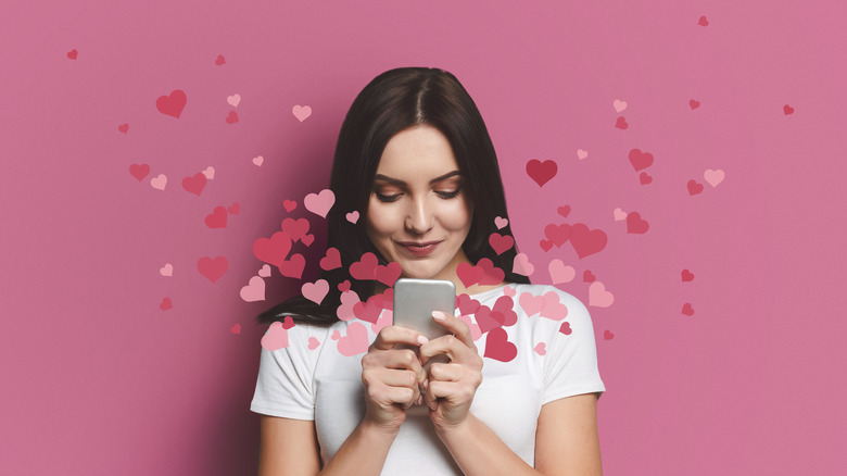 brunette on dating app with hearts