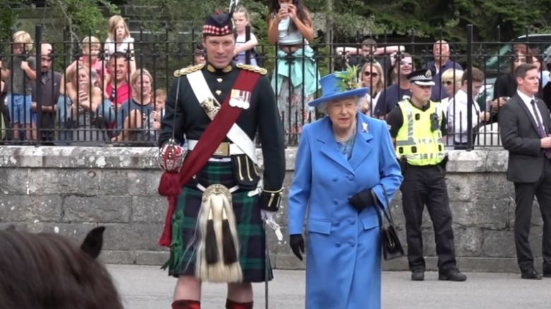 Major Jonathan Thompson and Queen Elizabeth at Balmoral Estate