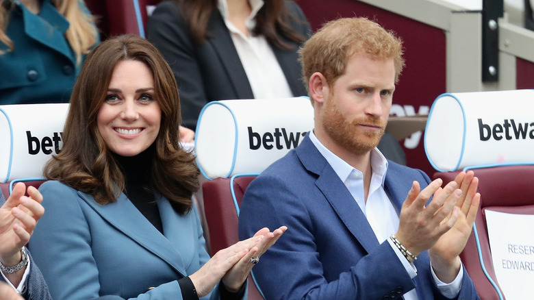 Prince Harry and Kate Middleton at an event. 