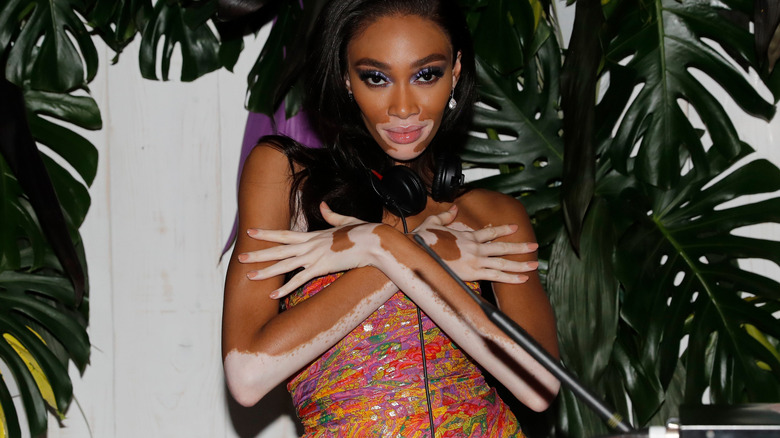 Winnie Harlow DJing at event 