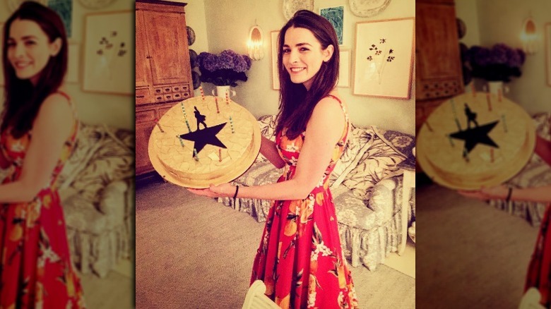 Bee Shaffer holding a Hamilton cake