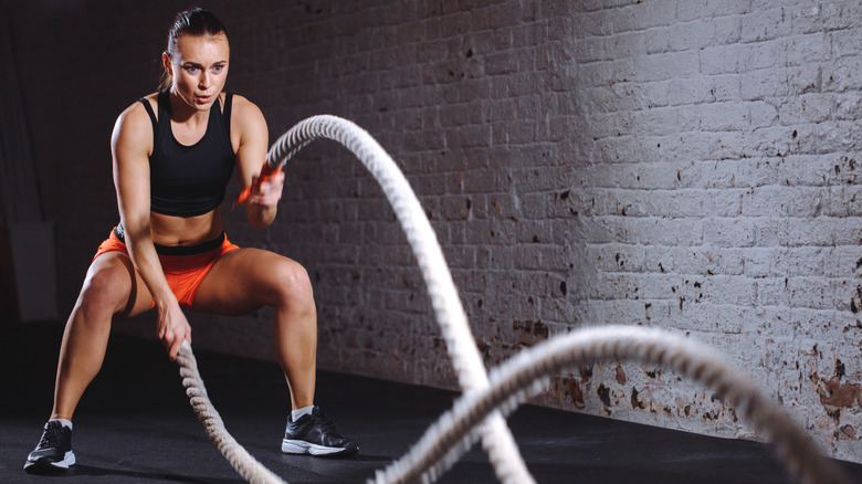 Woman training with rope