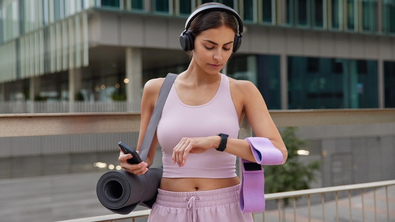 Woman looking at her watch