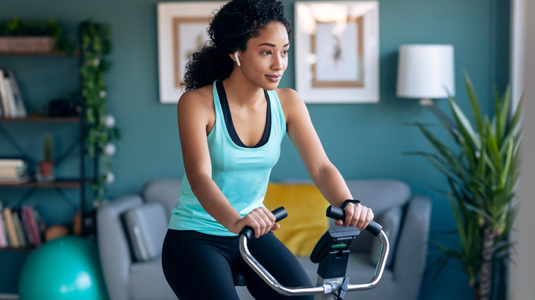 Woman riding a stationary bike