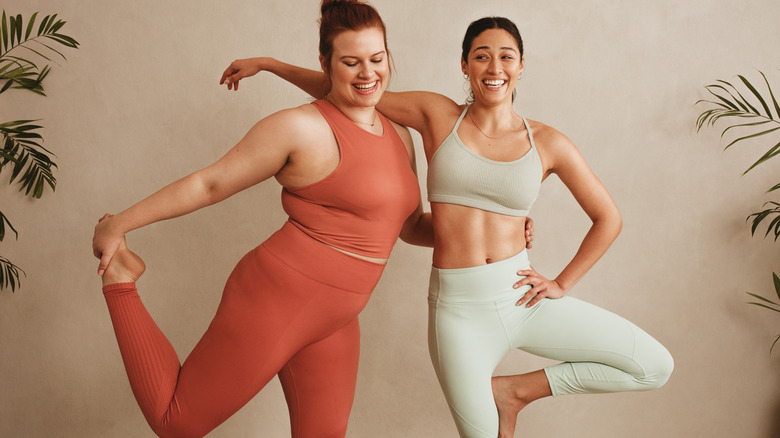 Two women holding yoga poses
