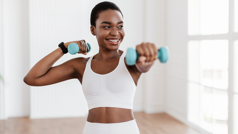 Woman exercising with weights