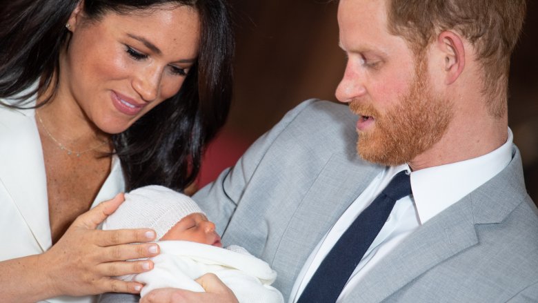 Meghan and Harry looking at newborn son