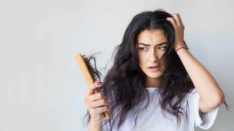 woman with massive hair shedding