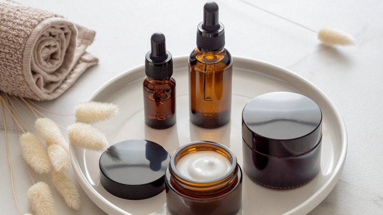 Bottles of skincare products on tray