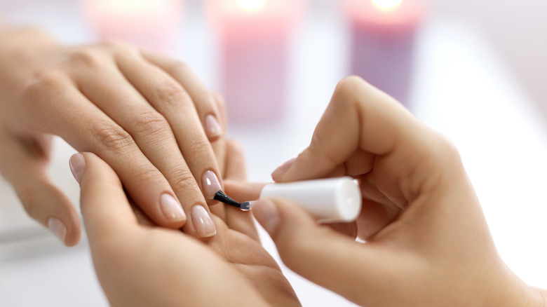 A woman getting a manicure.