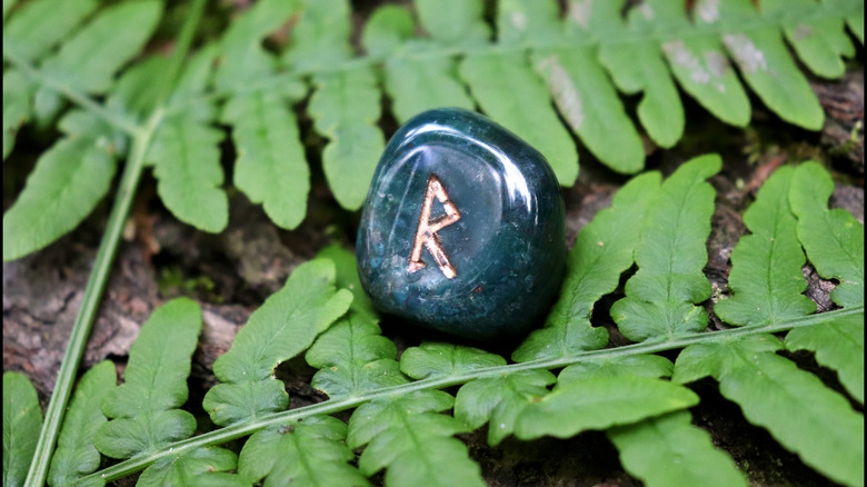 A bloodstone rune with a symbol on a leaf