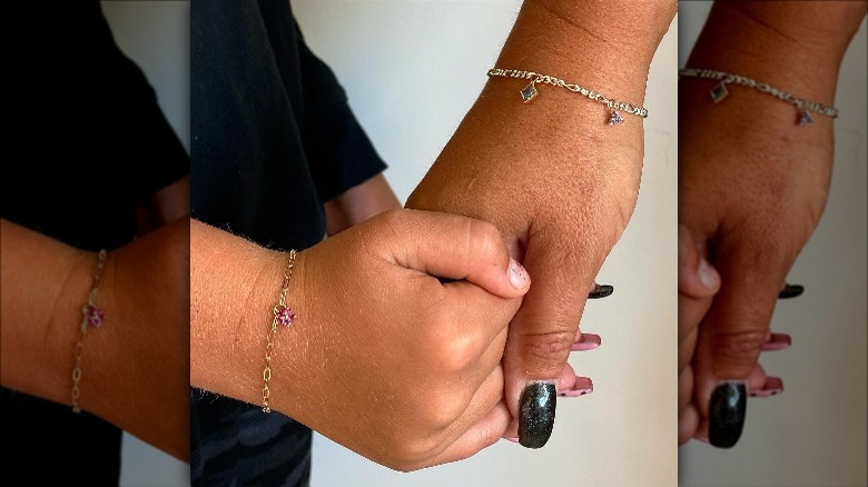 mother and daughter with permanent bracelets