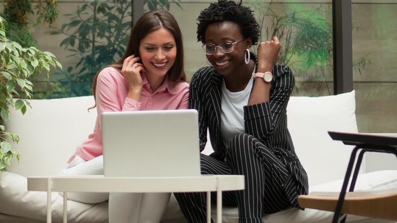 two women looking at laptop