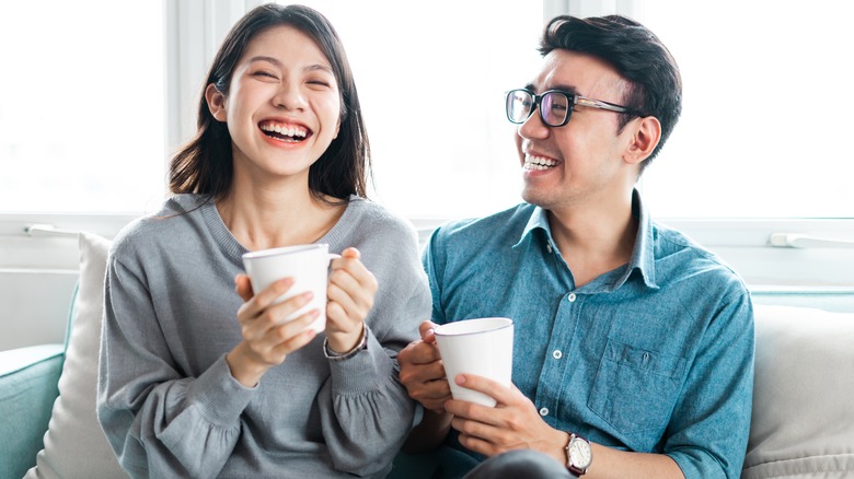 woman and man laughing