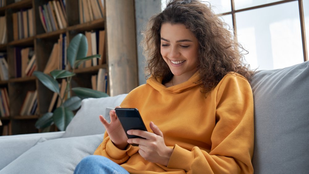 A woman shopping on her smart phone