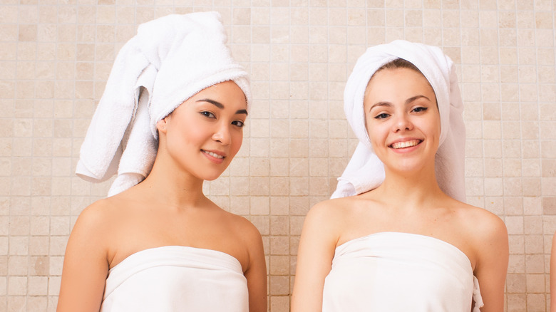 Women wearing towels in a bathhouse