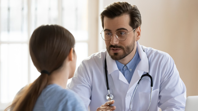 woman speaking to doctor