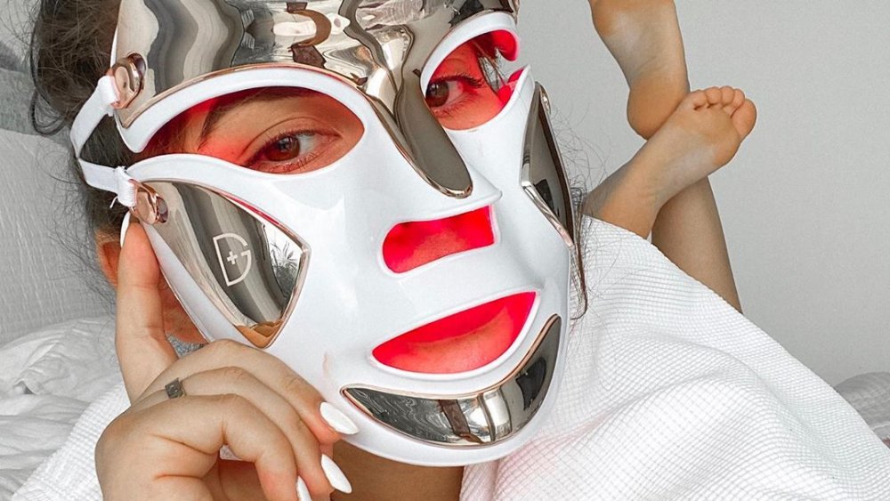 LED face mask on woman