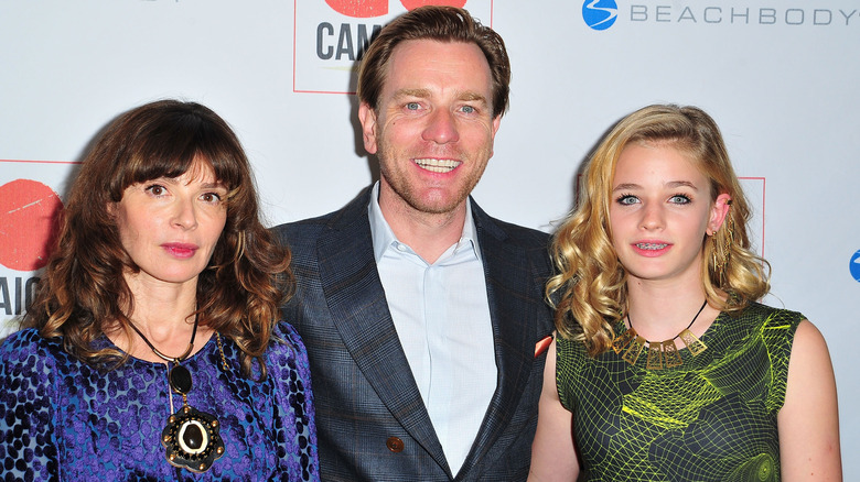 Eve Mavrakis, Ewan McGregor, and Clara McGregor as a child, posing