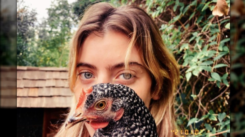 Clara McGregor holding a chicken