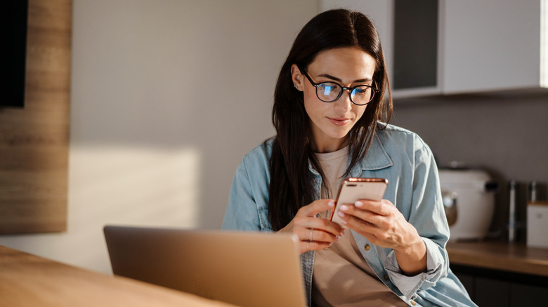 A woman scrolling on her phone 