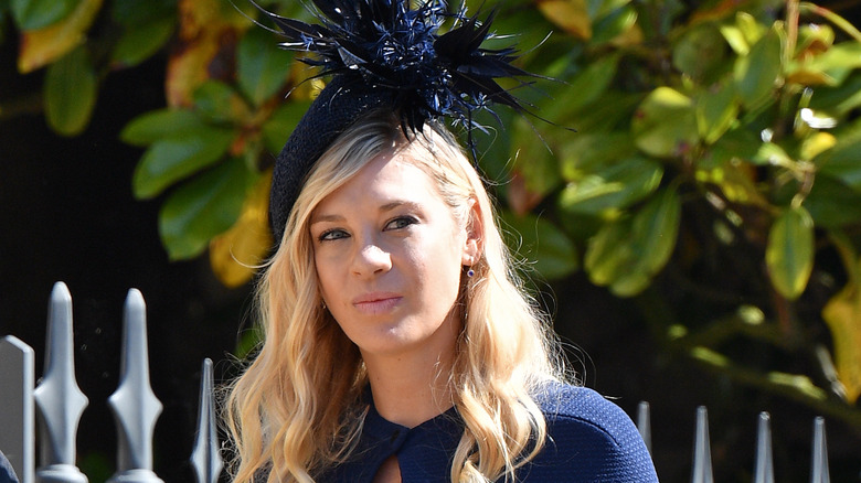 Chelsy Davy walking at event