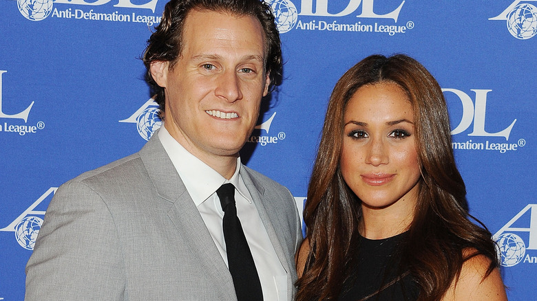 Trevor Engelson and Meghan Markle