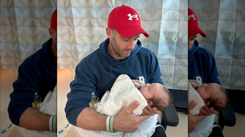 Luke Macfarlane holding baby