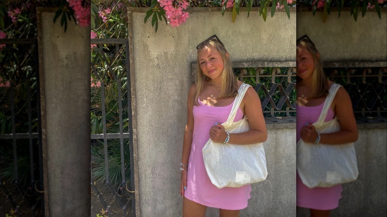 Woman in pink dress smiling