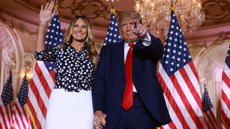 Melania Trump and Donald Trump holding hands