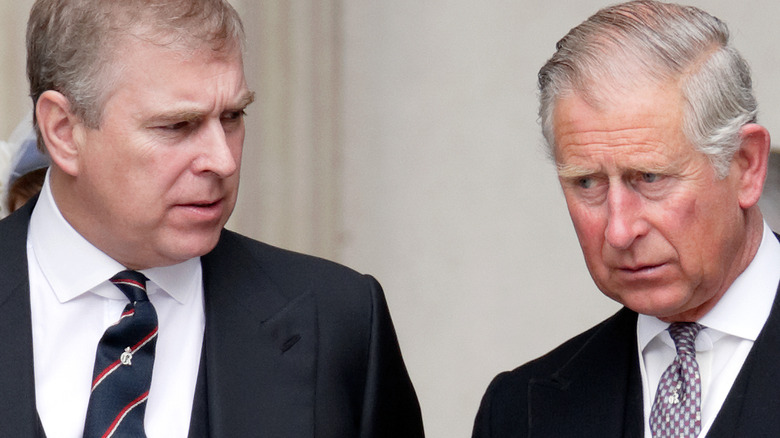 Prince Andrew and Prince Charles conversing 