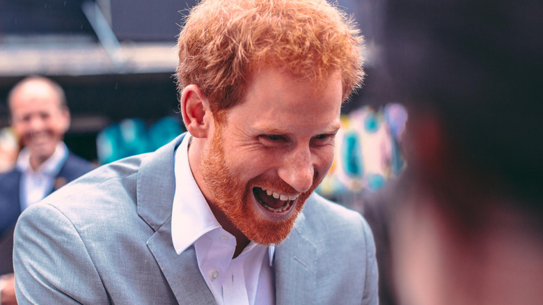 Prince Harry happily laughing