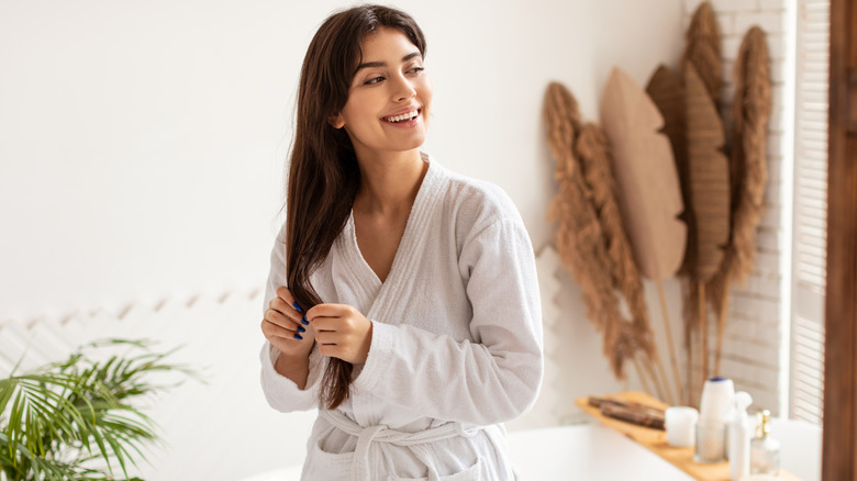 woman smiling in bathrobe