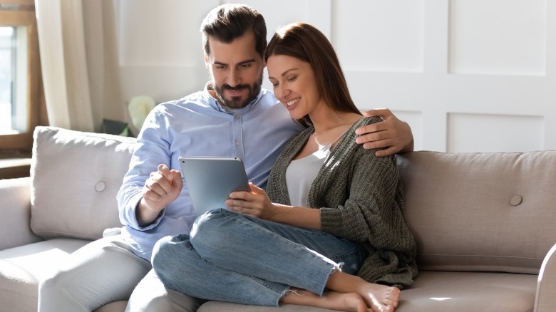 couple watching tablet together