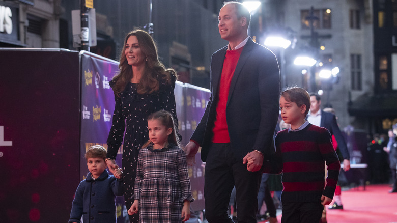 Prince William and their three children at an event. 