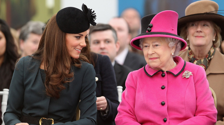 Queen Elizabeth and Kate Middleton at an event. 