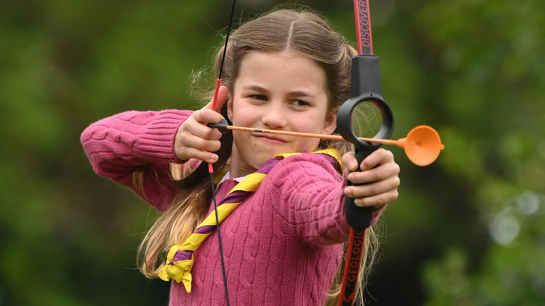 Princess Charlotte doing archery at a scouts' event