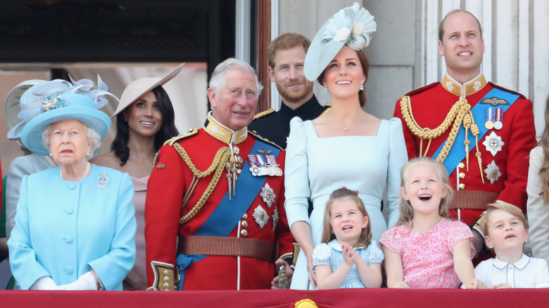 Meghan Markle standing on the balcony at Buckingham Palace with members of the royal family