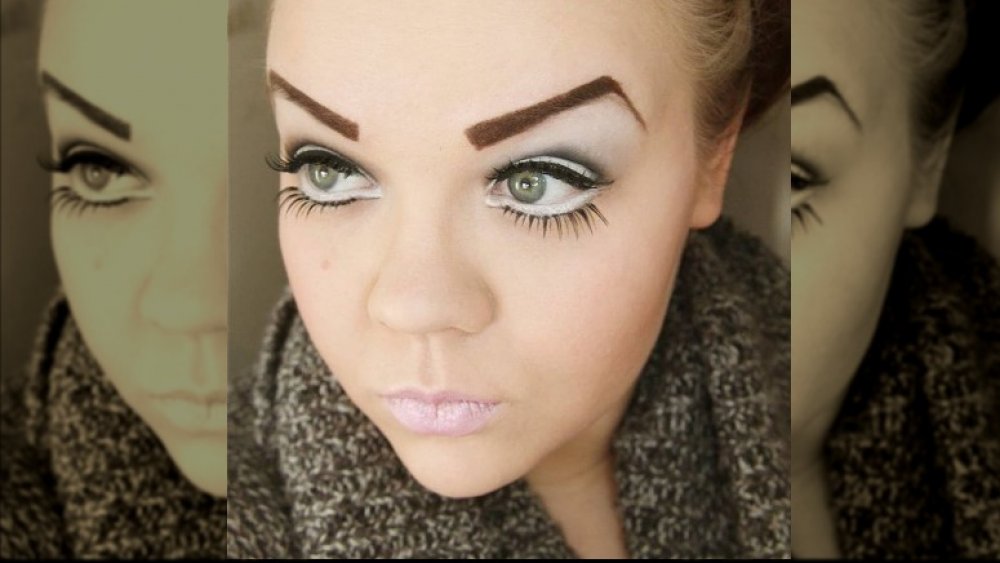 Woman with over-arched brows