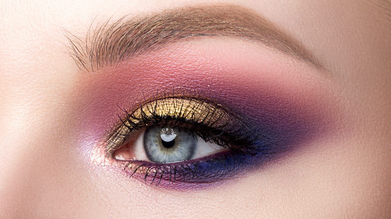 model wearing gold eyeshadow