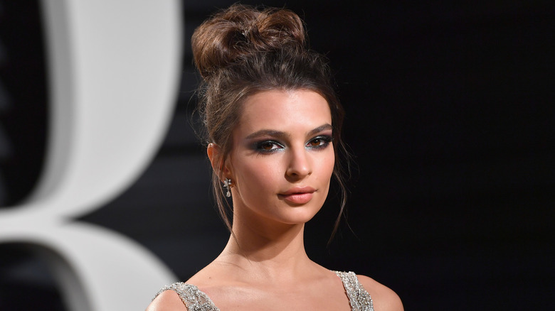 Emily Ratajkowski in silver dress and bun updo