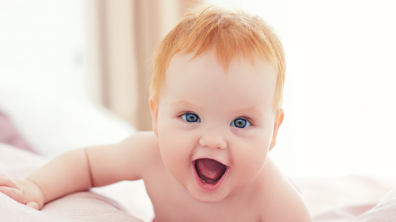 redhead baby crawling