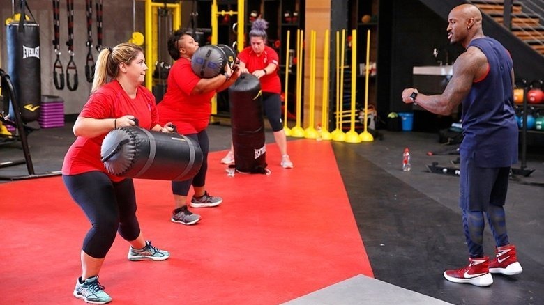 Contestants with punching bags on The Biggest Loser