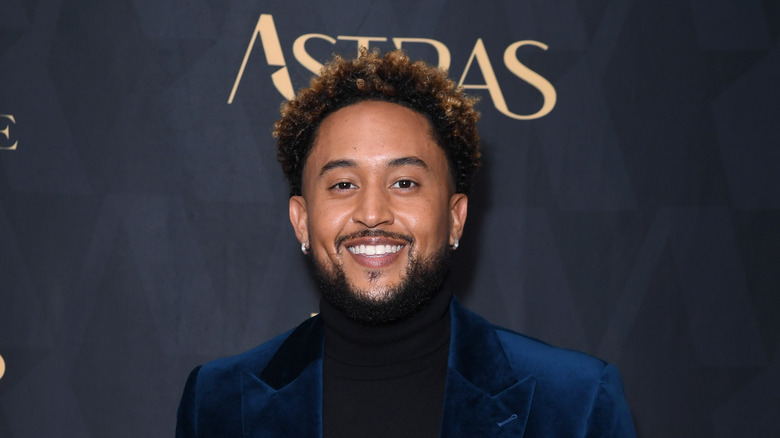 Tahj Mowry posing at an event